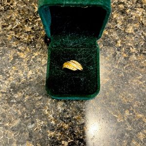 Diamond ring 14 kt yellow gold with diamonds . Size 7 .